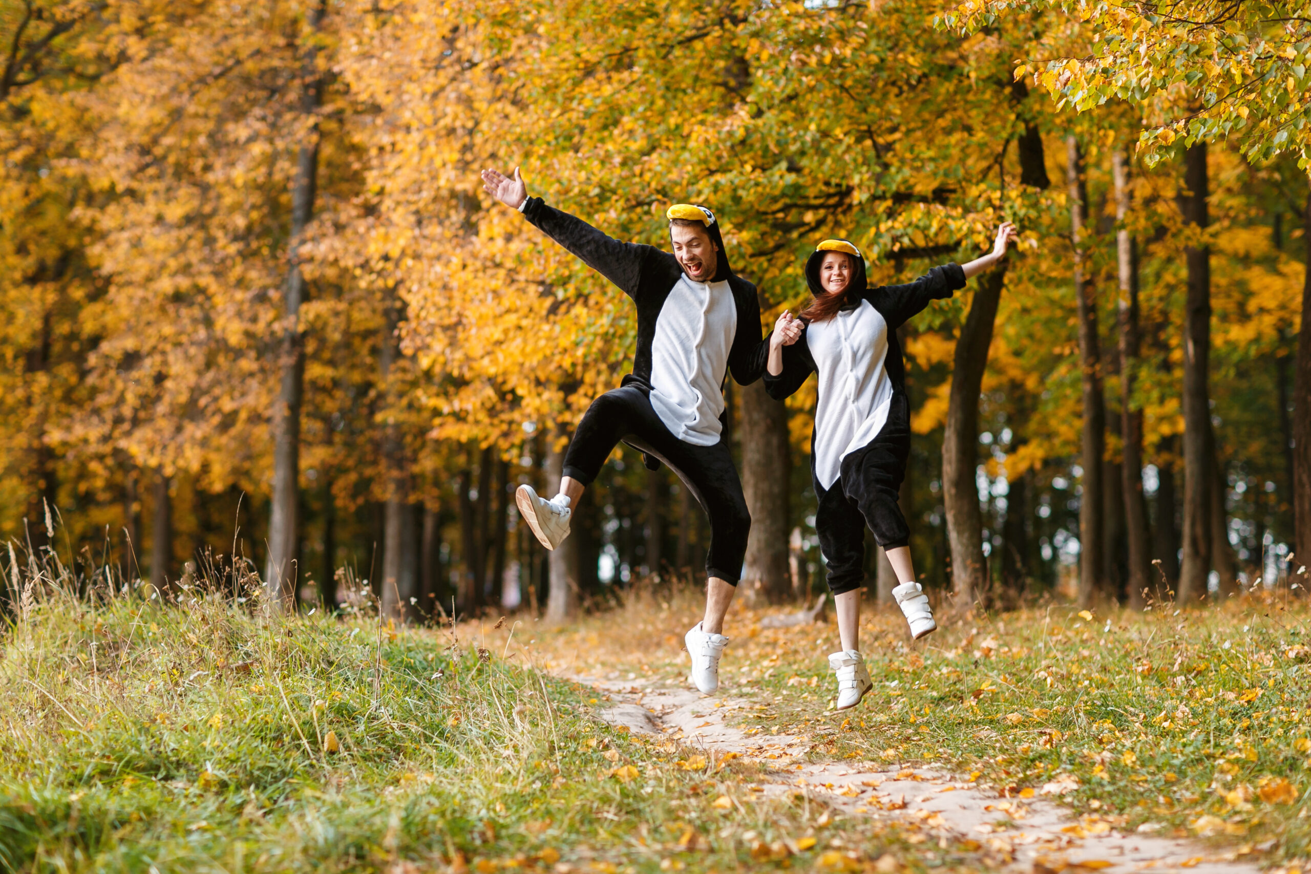 Couple,In,Matching,Penguin,Pajamas,In,Autumn,Forest